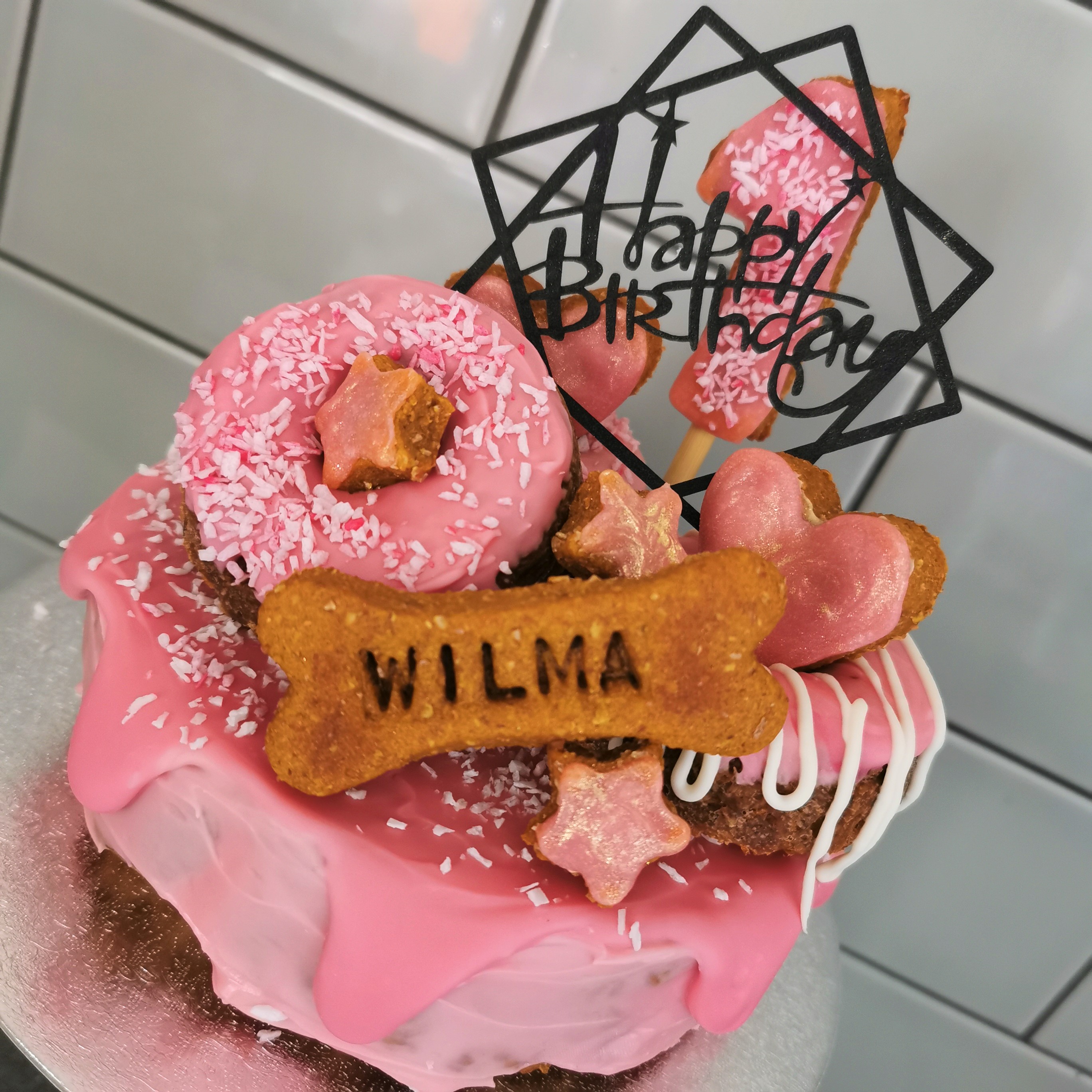 Dogs eating a homemade Dog Celebration Cake