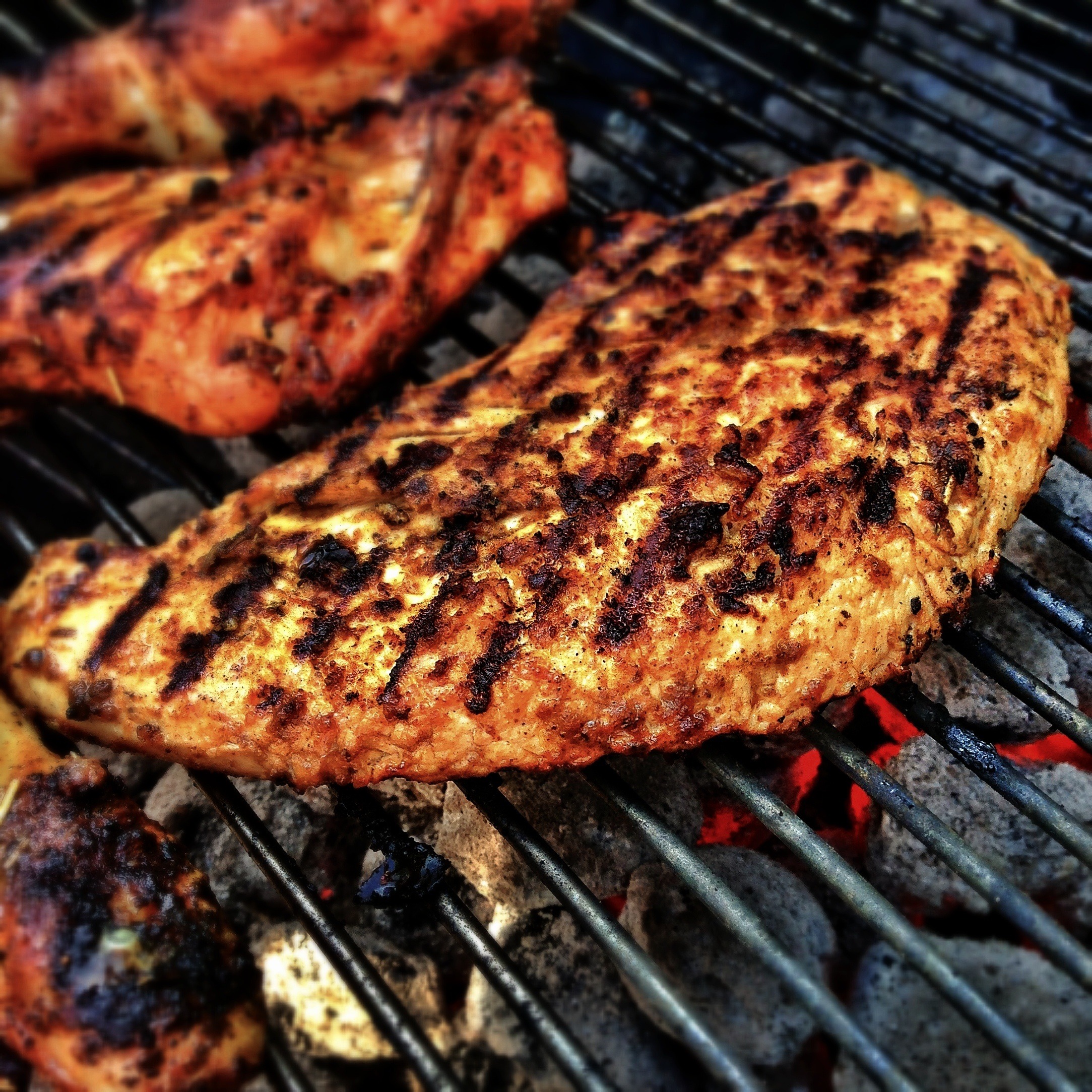Chicken from Pembrokeshire roasting on a grill