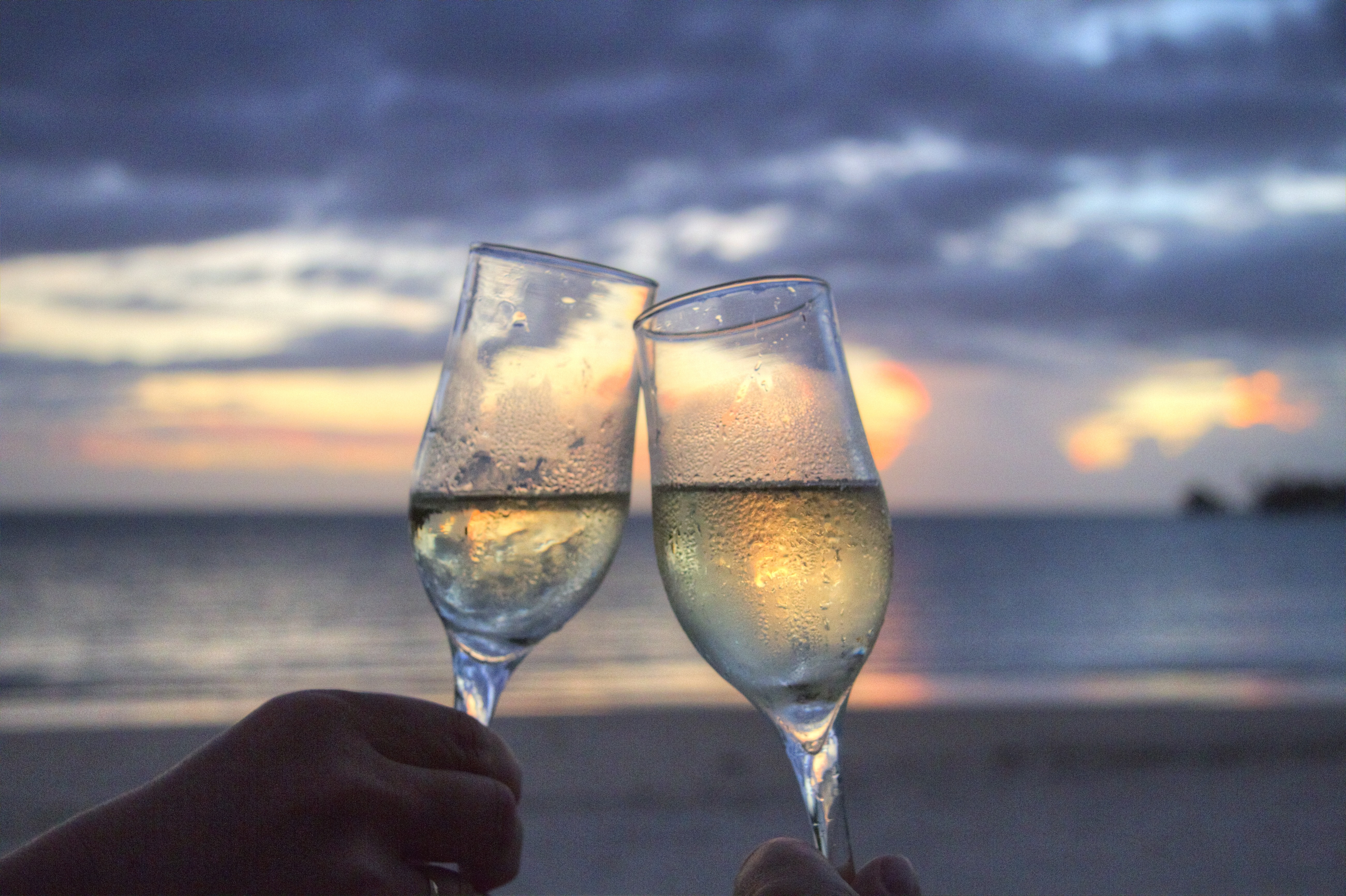 A couple drinking Heidsieck Monopole Champagne at Newgale Beach