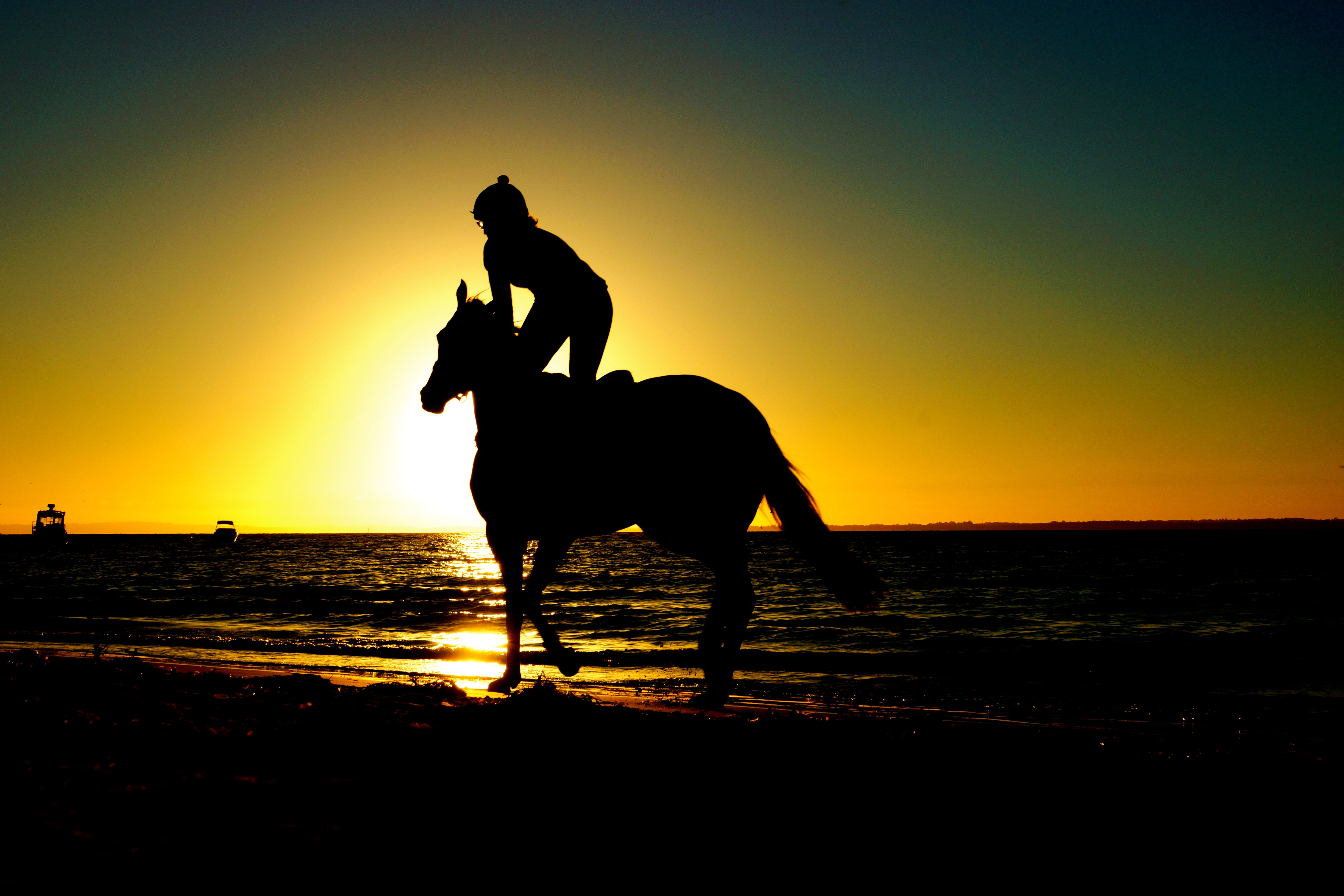 Girl riding horse on a Pembrokeshire Beach