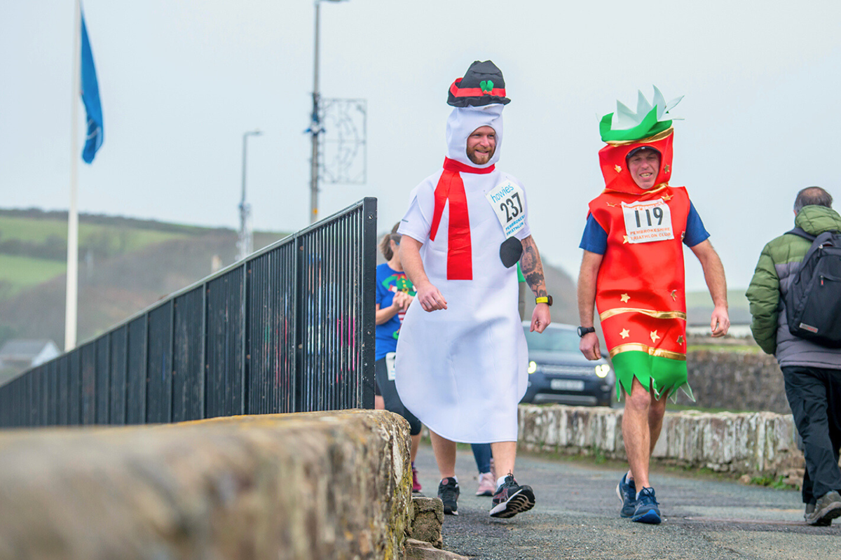 Athletes in fancy dress at Broad Haven Xmas Pudding Run, Pembrokeshire